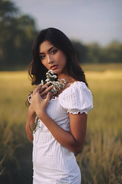 Lifestyle fashion portrait of stylish young asian woman posing outdoor - Valokuva, kuva