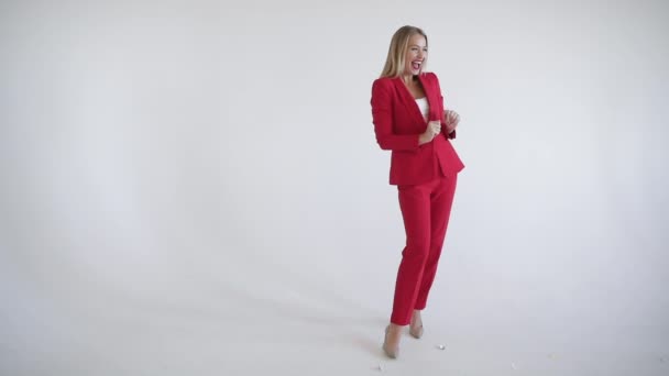 Funny woman in suit catching Christmas gift. - Video