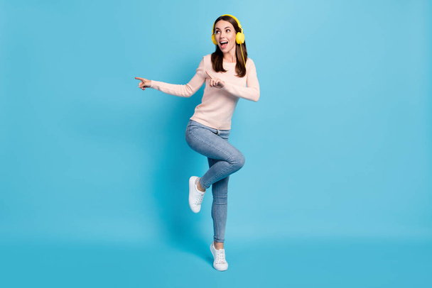 Full length body size view of her she nice attractive pretty cheerful cheery glad funky girl fan jumping listening hit dancing having fun isolated over bright vivid shine vibrant blue color background - Fotografie, Obrázek