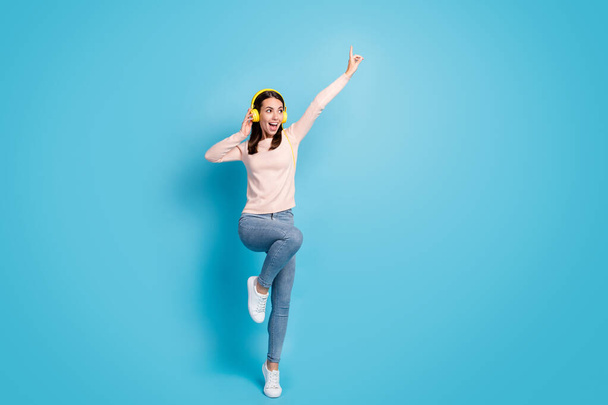 Full length body size view of her she nice attractive pretty cheerful cheery girl fan jumping listening hit bass dancing isolated over bright vivid shine vibrant blue color background - Foto, Imagem