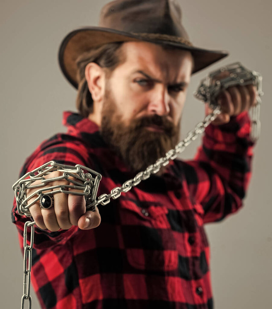 you are next. problem solving. man in captivity. concept applicable for business. man tearing heavy steel chain by hands. conceptual symbol of freedom. male fashion. strong man with chains - Photo, Image