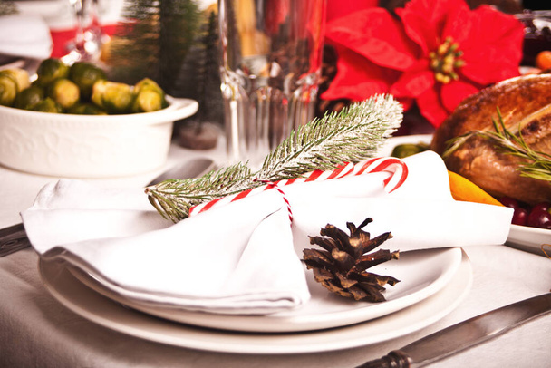 Christmas table setting with holiday decorations. New Year celebration. - Valokuva, kuva