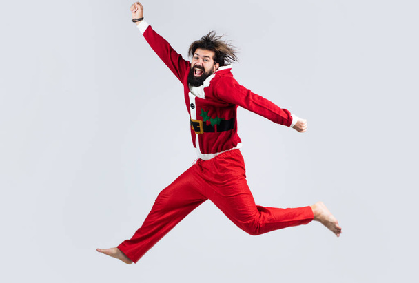 happy new 2021 year. merry christmas. xmas party fun. happy bearded man hipster wear red festive elf costume. mature santa claus jumping. funny winter holiday celebration. feel free - Valokuva, kuva