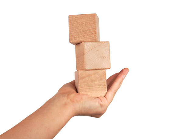 Wooden square cube in hand isolated on the white - Foto, immagini