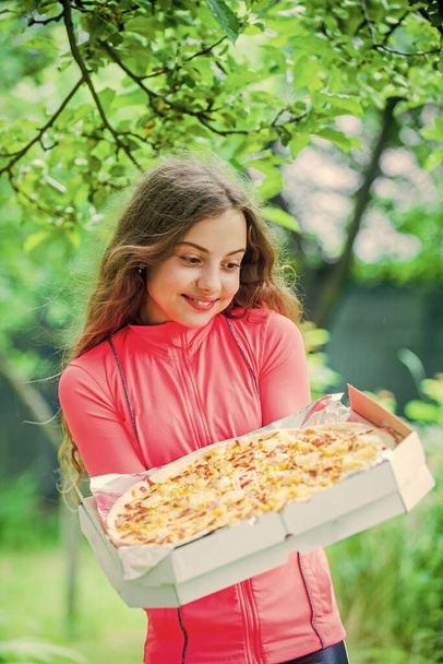 juicy pizza. unhealthy and healthy food. happy childhood. child feel hunger. hungry kid going to eat italian pizza. fast food concept. happy childrens day. little girl eating pizza. pizza delivery - Fotografie, Obrázek