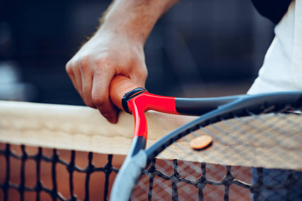 Tennis racket and tennis net on tennis court - Fotoğraf, Görsel
