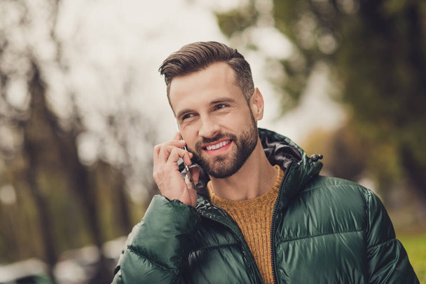 Photo of charming positive person speak phone look far away toothy smile nice weekend journey outdoors - Fotoğraf, Görsel