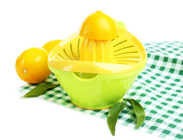 Citrus press and lemons isolated on white - Foto, imagen