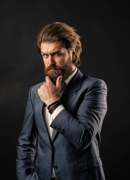 love his beard. handsome man on gray background. serious bearded businessman. stylish mature man looking modern. mens office wardrobe. fashionable man dressed in suit. formal fashion model - Фото, изображение