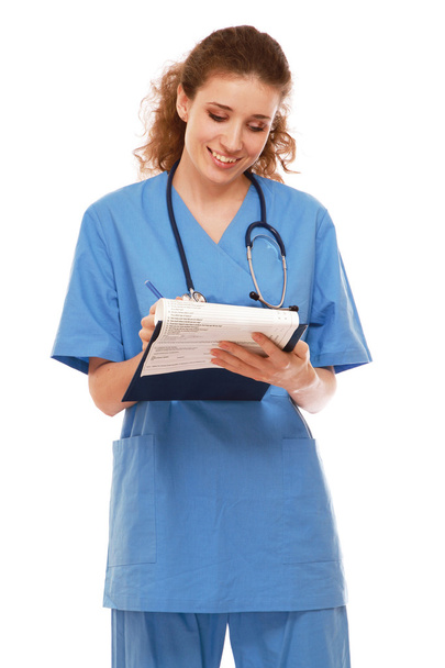 Female doctor with a clipboard - Фото, зображення