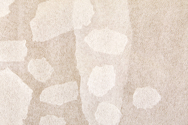 White plastic foam sheet pieces on cardboard background. Closeup of torn foam polyethylene pieces. - Fotó, kép