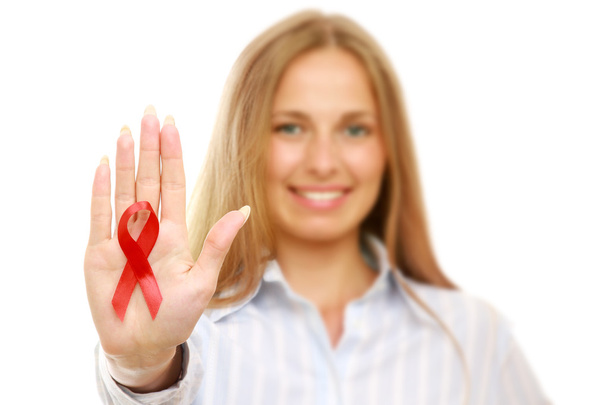 Woman with an aids ribbon - Photo, image