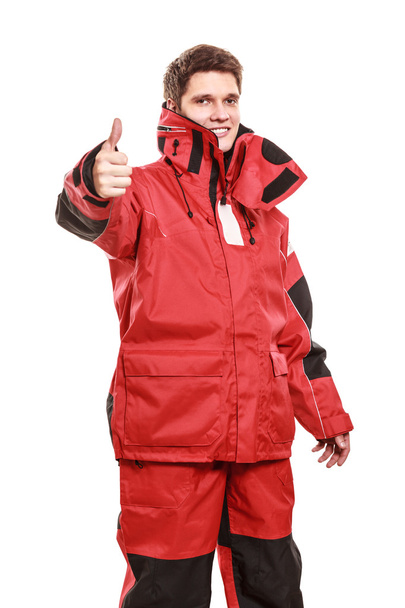 Young man sailor in red wind jacket. Sailing. - Foto, Bild