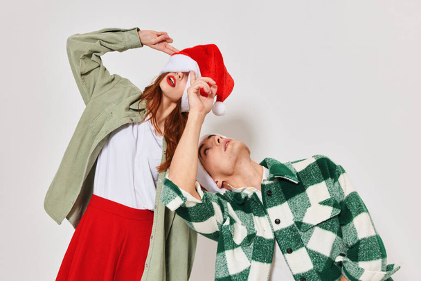 Man and woman Christmas hat Christmas Studio emotions holiday - Foto, Imagem