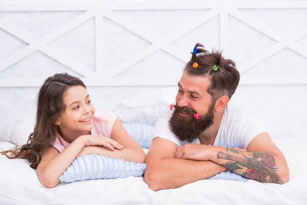 father with funny hairstyle and daughter having fun on family day, happy family - Photo, image