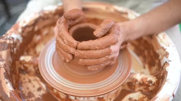 Ceramist working with pottery at the ceramic workshop. Handmade products. Close-up. - Footage, Video