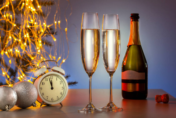 Merry Christmas And Happy New Year. Champagne And New Year Decoration With Vintage Clock And Holiday Lights. - Zdjęcie, obraz