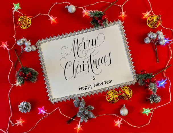 Happy New Year and Merry Christmas!  flat lay, with text - Merry Christmas, on a red background - Photo, Image