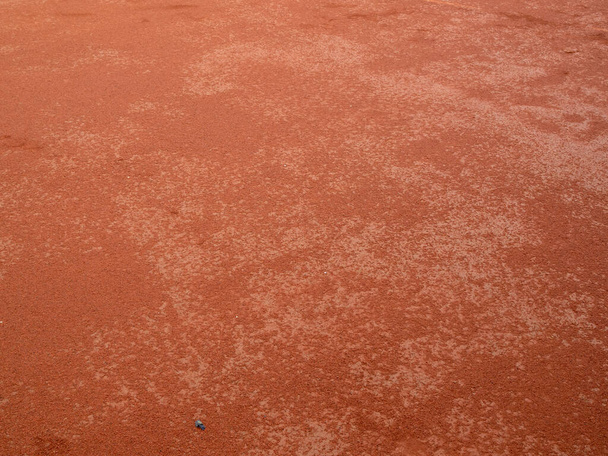 Красная глина текстура теннисного корта. Поверхность красного спортивного поля. - Фото, изображение