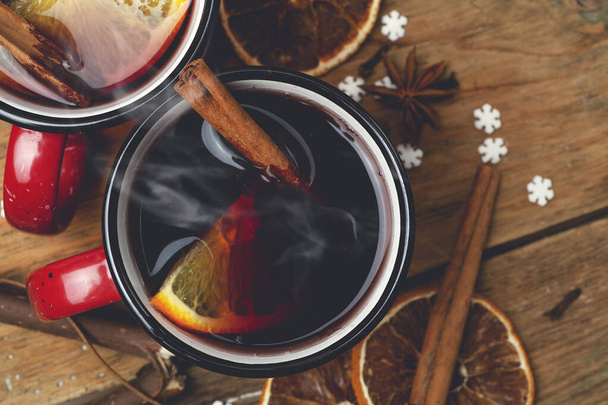 Mulled wine background. A hot winter Christmas drink based on red wine, spices and citrus fruits. - Photo, Image