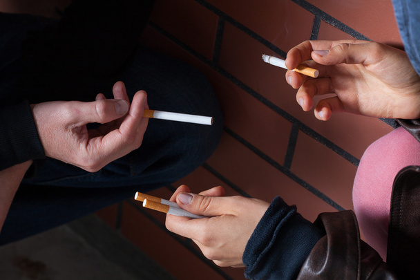 Exchanging cigarettes closeup - Fotó, kép