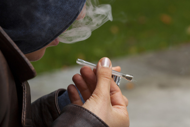 Young boy smoking marijuana - Фото, зображення