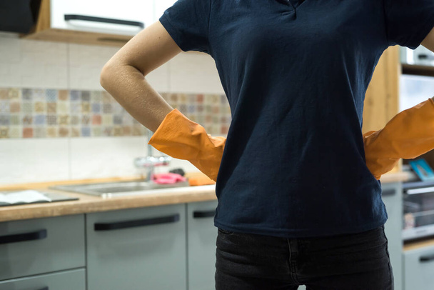 woman holding a rag in the kitchen and ready to clean. concept of cleanliness - Photo, Image