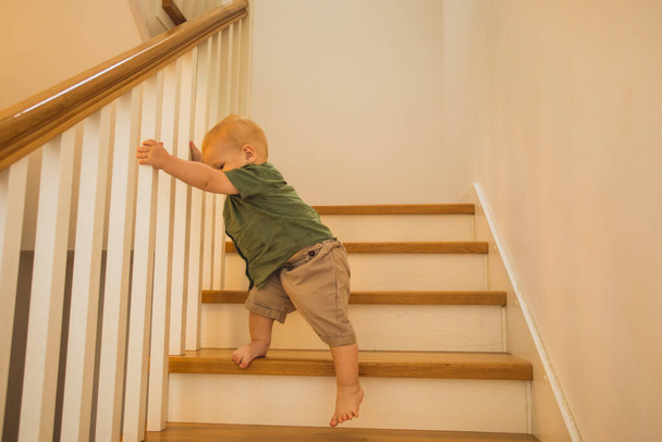 Toddler boy is training new skills on stairs - Fotó, kép