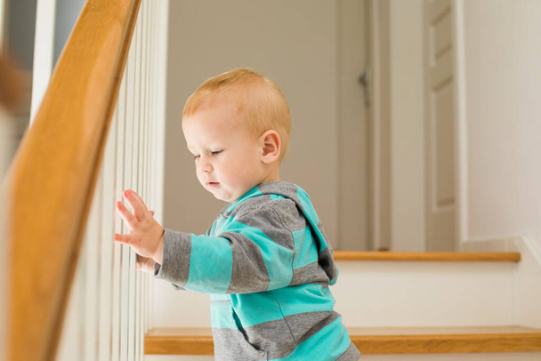 Playing hide and seek on stairs at home - Fotoğraf, Görsel