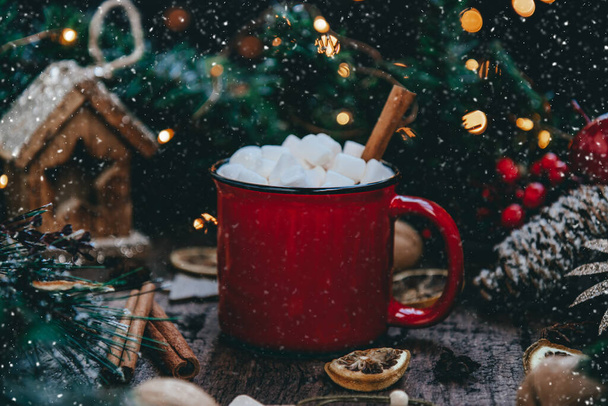 A mug of cocoa with marshmallows in a New Years setting - Fotó, kép