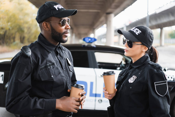 Multicultural Police Officers With Paper Cups Talking Free Stock Photo and  Image