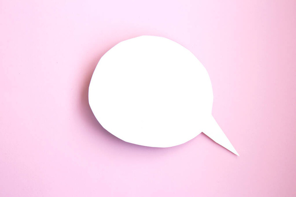 White paper speech bubble concept. Cartoon speech with clipping path on bright pink background with contrasting shadow - Photo, Image