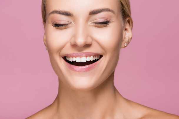 laughing beautiful blonde woman with perfect skin isolated on pink - Φωτογραφία, εικόνα