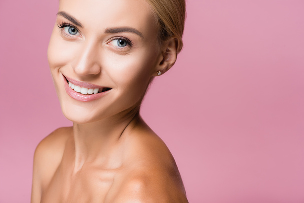 smiling beautiful blonde woman with perfect skin isolated on pink - Fotografie, Obrázek