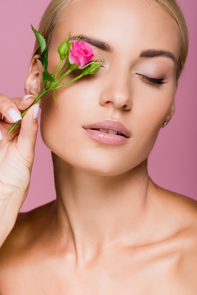 beautiful blonde woman with perfect skin and rose flower isolated on pink - Φωτογραφία, εικόνα