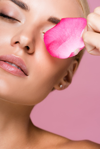 beautiful blonde woman with perfect skin and rose petal isolated on pink - Φωτογραφία, εικόνα