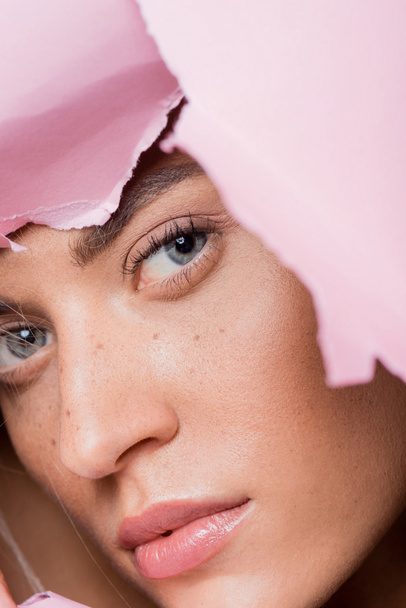 beautiful woman with freckles in pink paper hole - Φωτογραφία, εικόνα