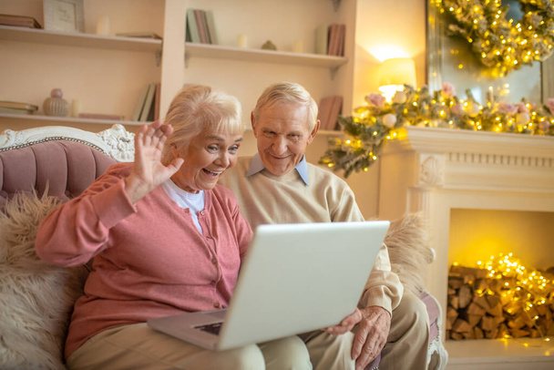Senior couple having a video call and looking happy - Photo, image