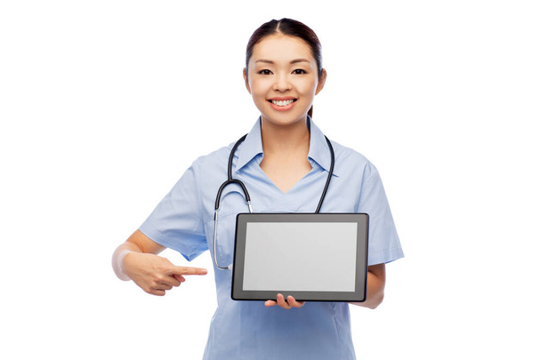 asian female doctor with tablet pc and stethoscope - 写真・画像