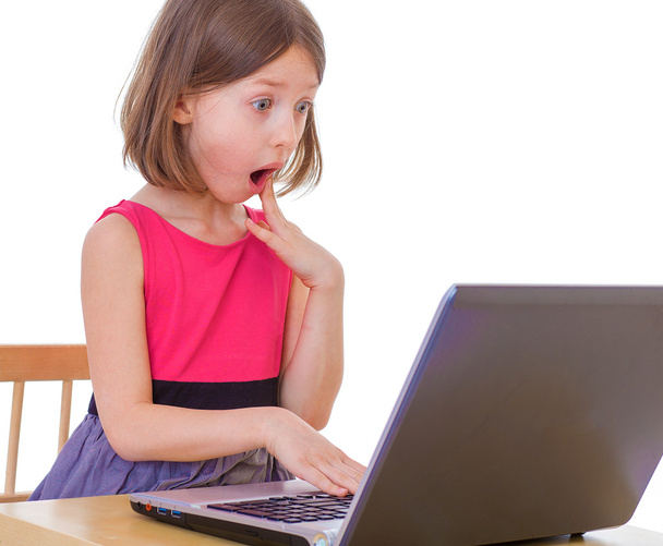  girl sitting at a laptop. - Fotó, kép