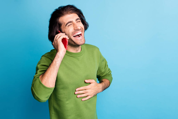 Photo of positive laughing guy hand on chest closed eyes wear pullover isolated on blue color background - Foto, imagen