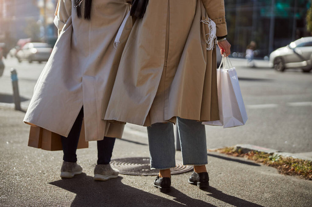 Two elegant women standing on the street - Fotó, kép