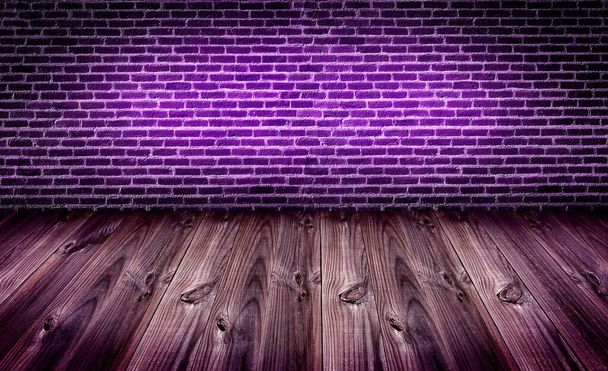 dark brickwall under purle light with wooden slats floor,night club background - Photo, Image