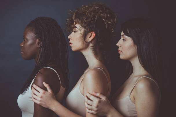 Three girls from different ethnicities posing in studio for a "body positivity" photo session - Fotoğraf, Görsel