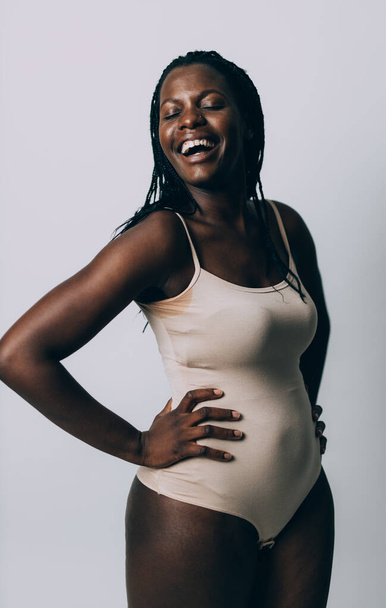 Beautiful girl posing in studio for a "body positivity" photo session - Photo, image