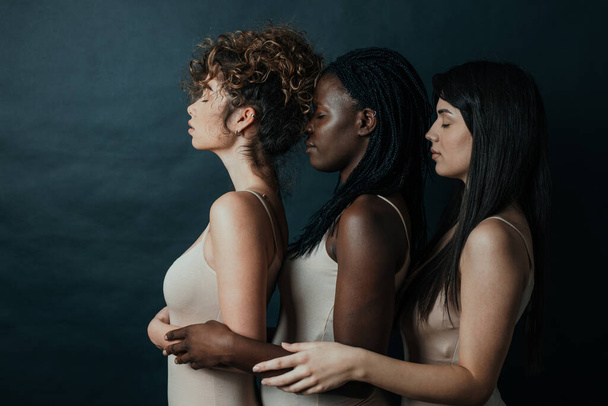 Three girls from different ethnicities posing in studio for a "body positivity" photo session - Fotografie, Obrázek