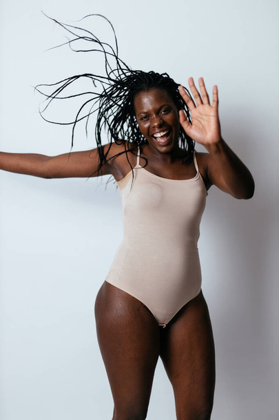 Beautiful girl posing in studio for a "body positivity" photo session - Фото, зображення