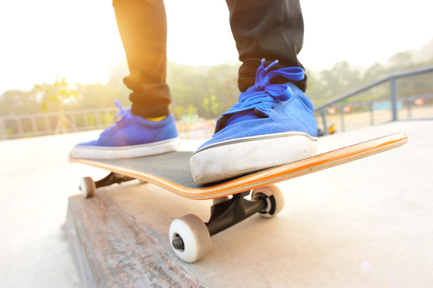 Sneakers on a skateboard - Fotó, kép