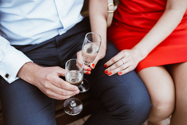 two hands holding glasses of champagne - 写真・画像