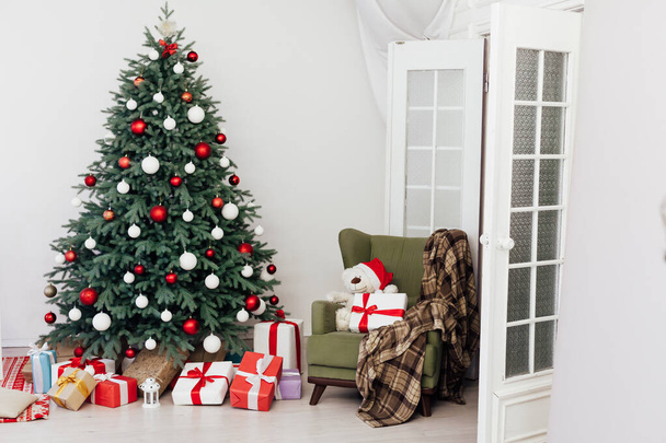 Christmas tree decor with gifts and garlands interior new year - Photo, Image